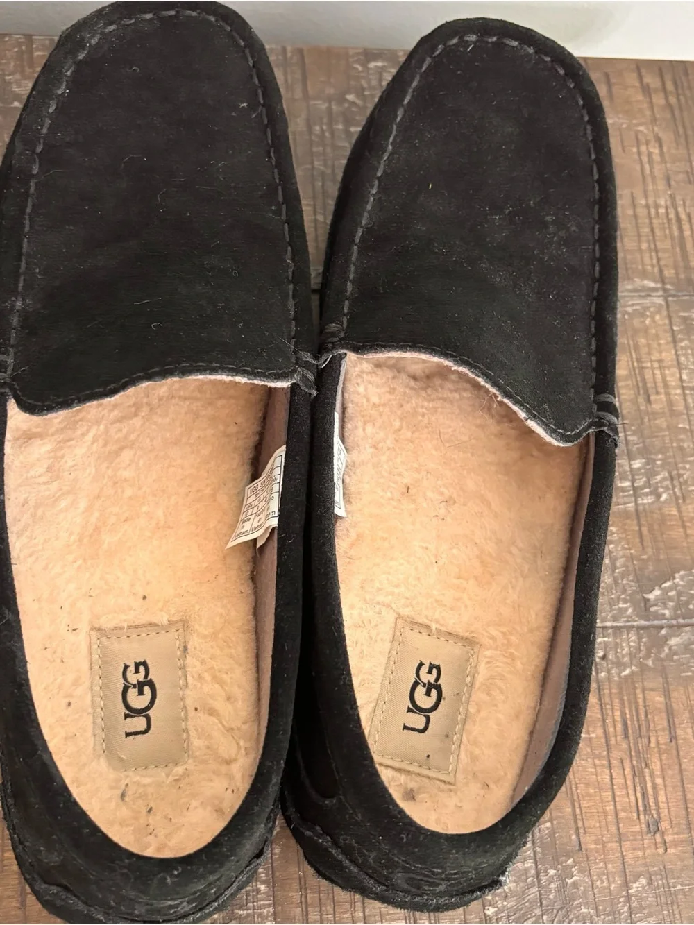 UGG Men's 10 Alder slippers crafted in black suede with a classic moc-toe stitch